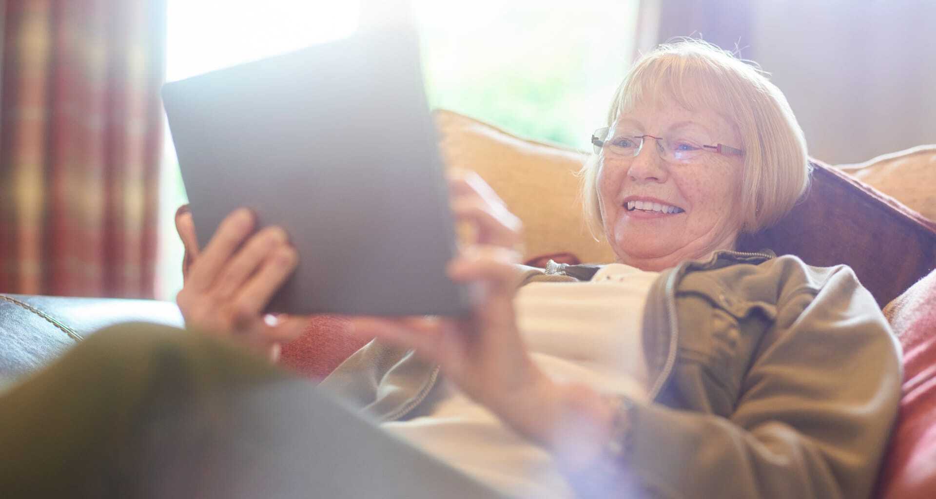 senior woman browsing on a tablet